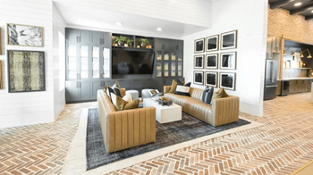 A living room with a large couch and a television.